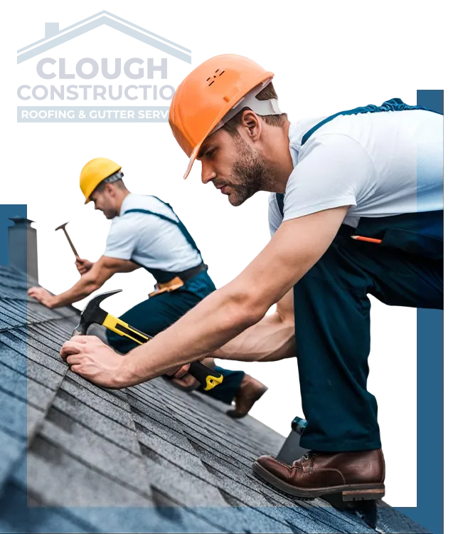 Two professional roofers wearing hard hats installing dark asphalt shingles on a pitched roof, featuring the Clough Construction logo in the background