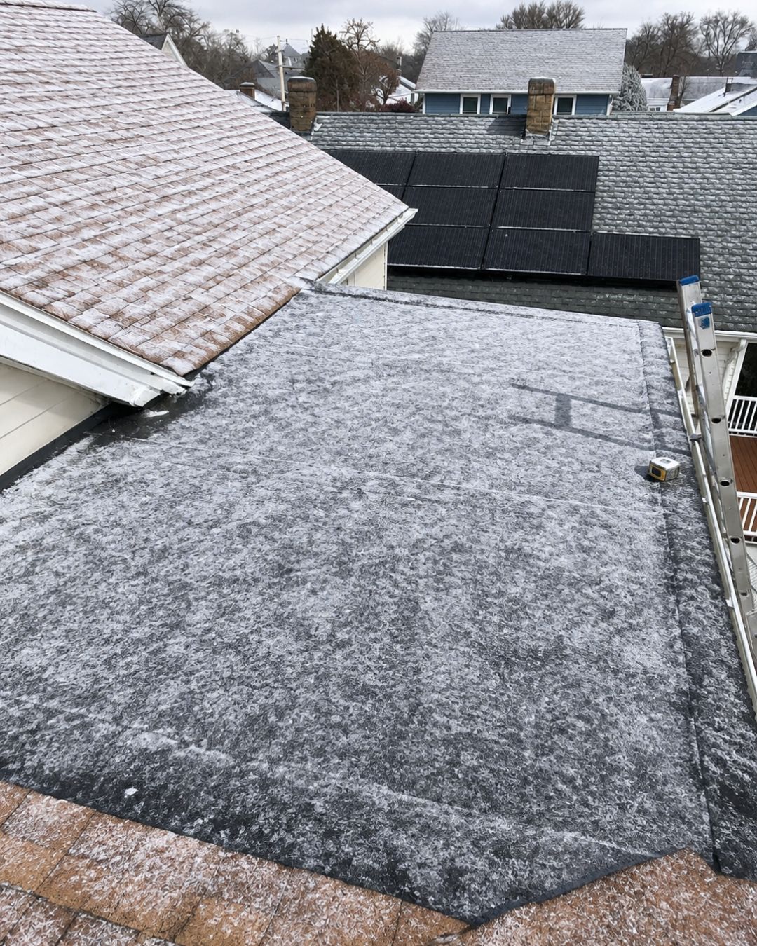 Completed EPDM rubber roofing system designed for New England weather on a Massachusetts home.