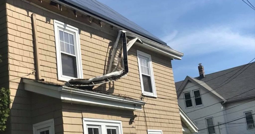 Exterior roofline wood and fascia being evaluated during residential carpentry work.