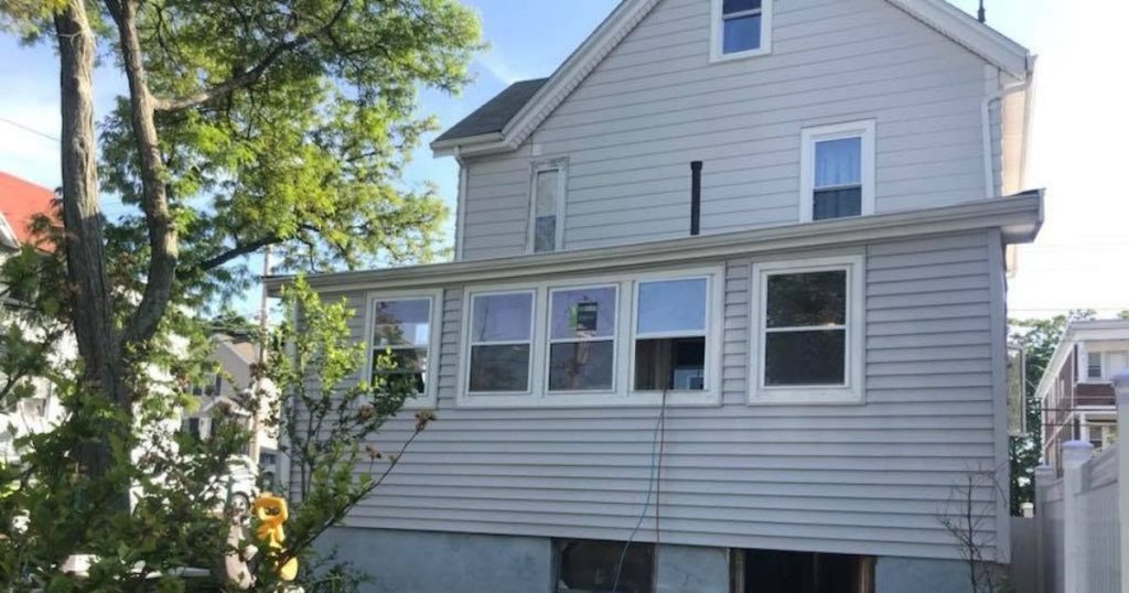 Porch and window exterior renovation with new siding and windows