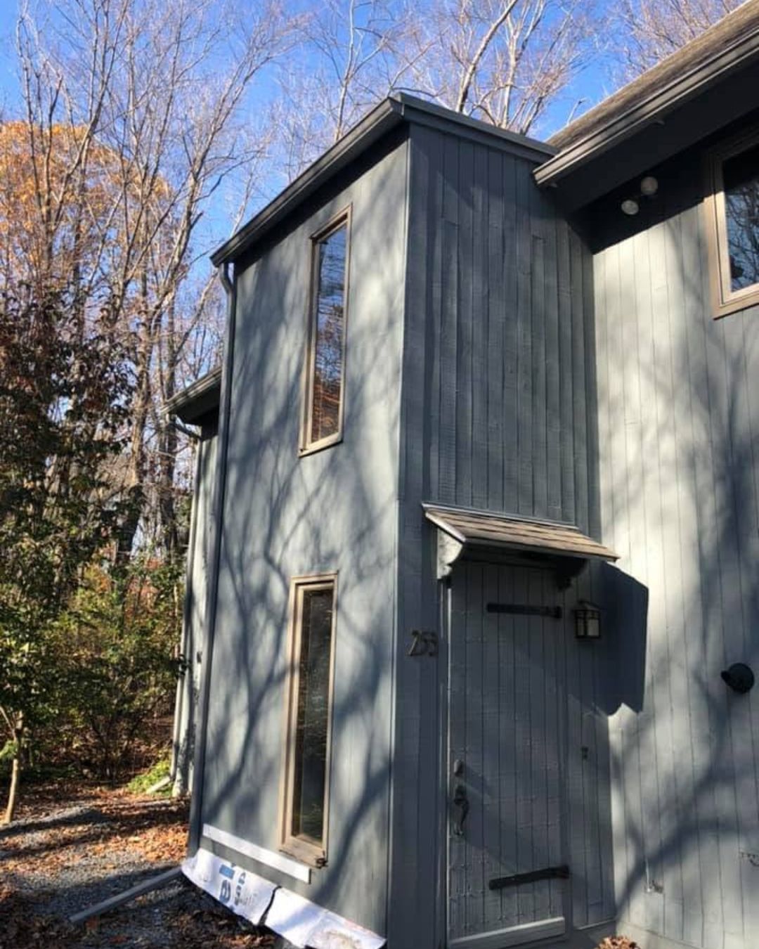 Professional inspection of an aging residential window on a Massachusetts home.