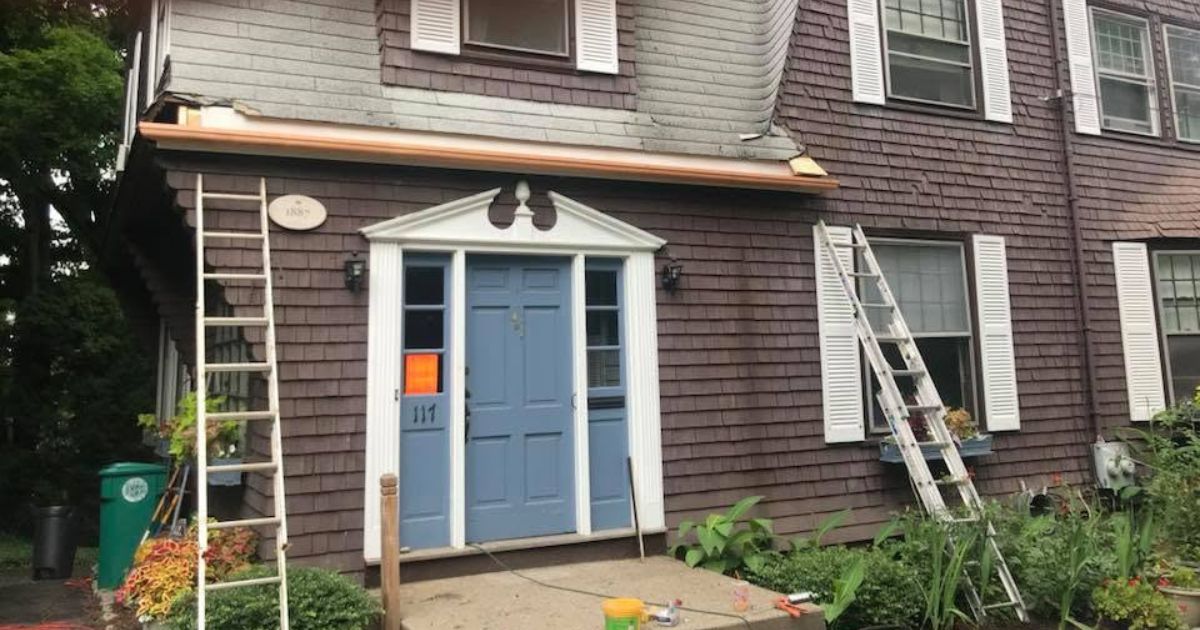 Residential gutters professionally installed along the roofline of a Greater Boston home.