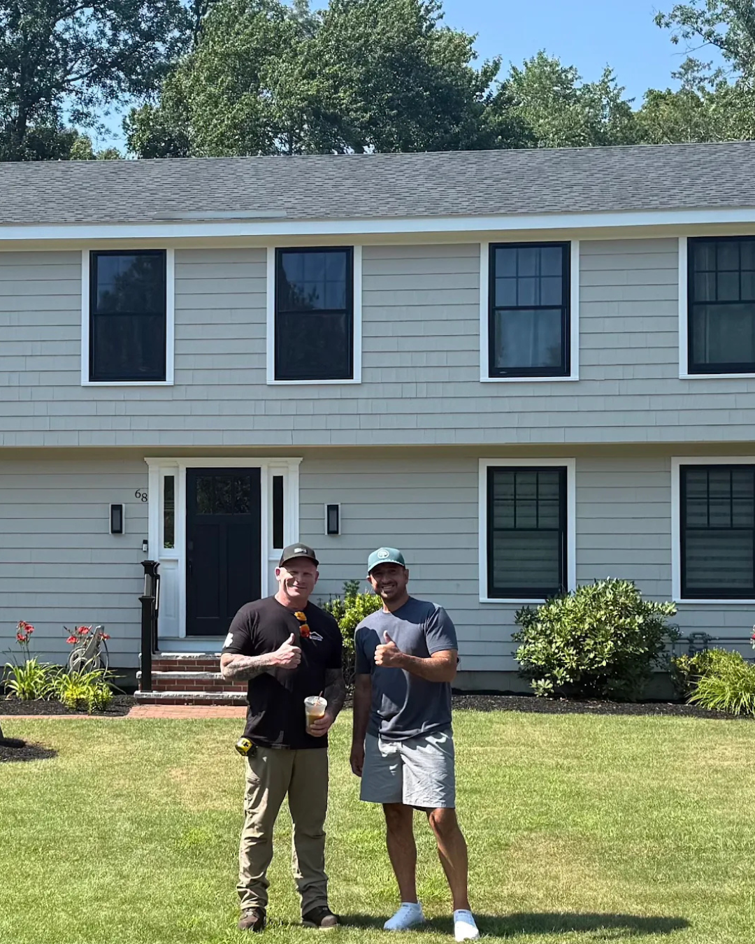 Robert Clough speaking with a satisfied homeowner after completing a residential roofing project in Greater Boston, Massachusetts.