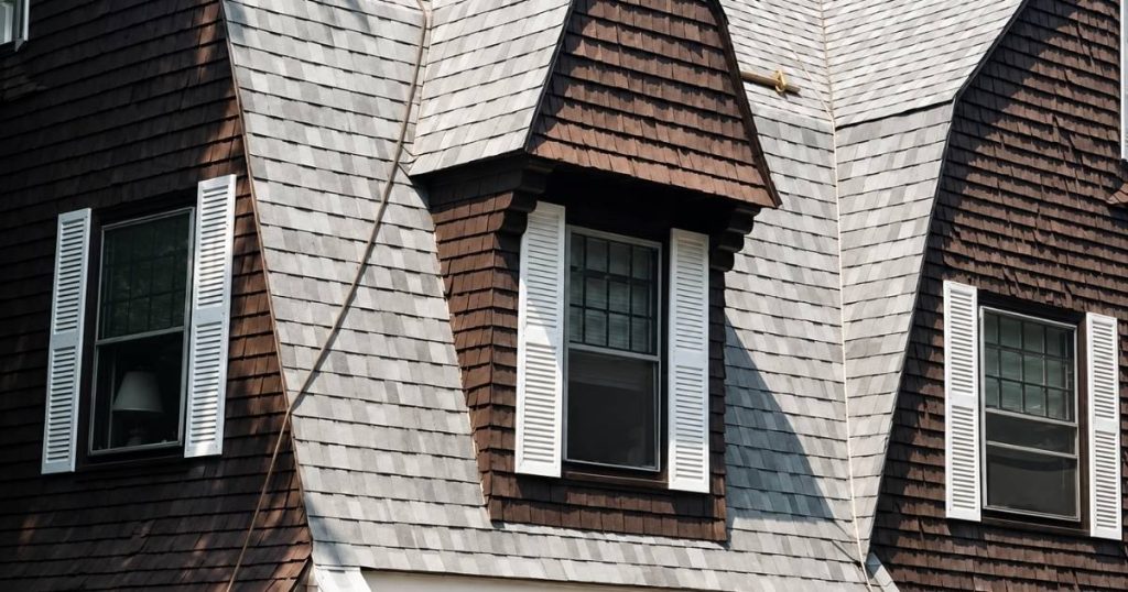 Completed roof replacement with wood gutter and fascia work