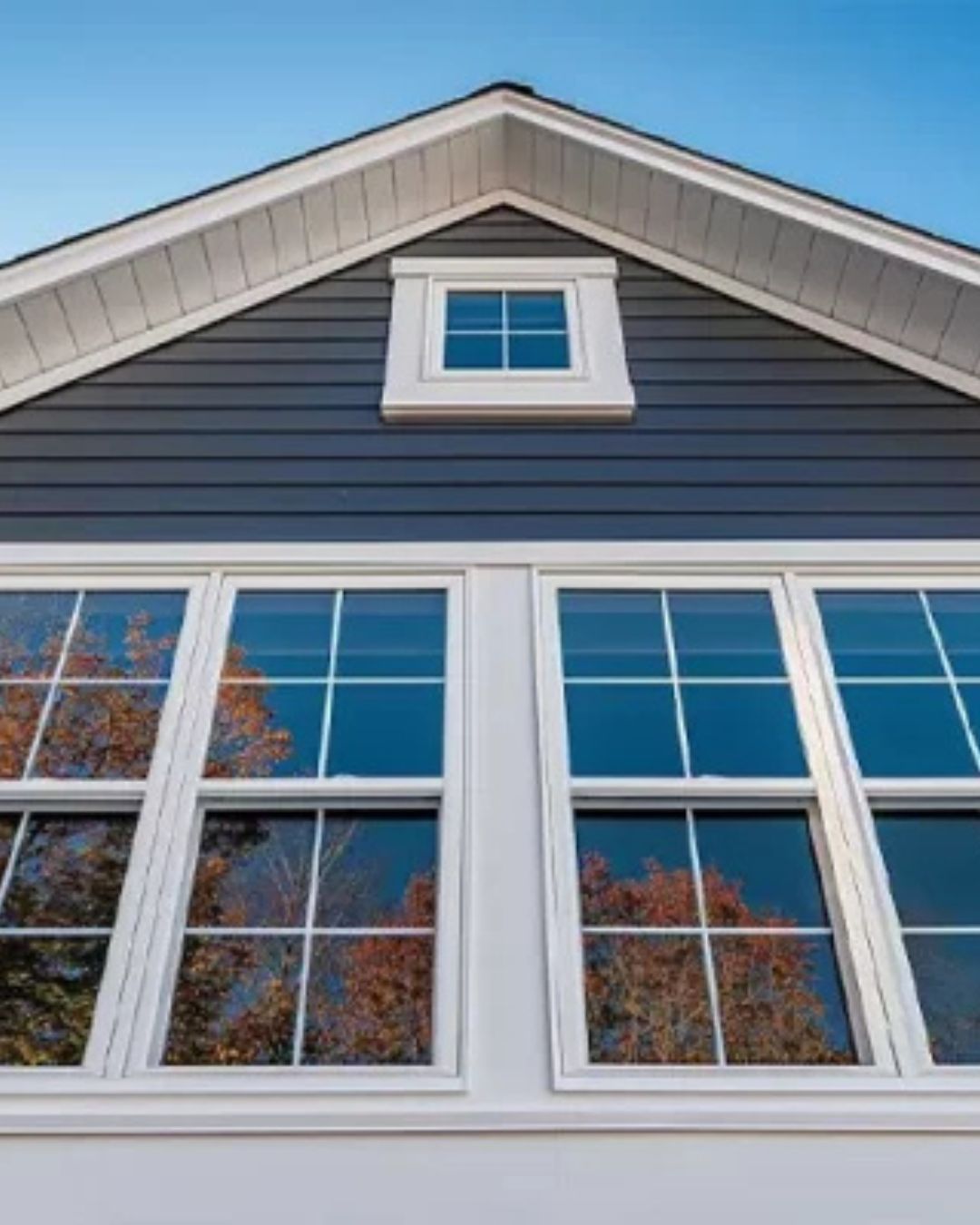 Completed siding and replacement window installation by Clough Construction in North Reading, Massachusetts.