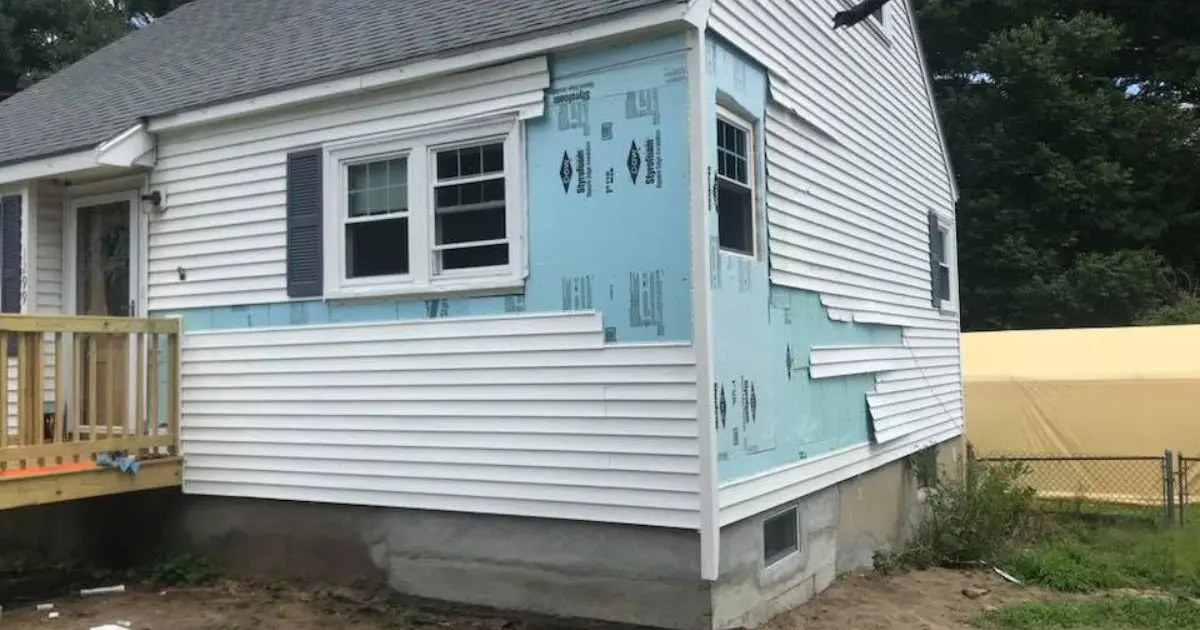 Weather-resistant barrier installed before new siding on a Massachusetts home.
